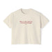 An off-white short-sleeve crewneck t-shirt with a red printed quote on the chest reading 'life's a race and I'm a ferrari strategist' and 'FERRARI' underneath, displayed on a clean white background.